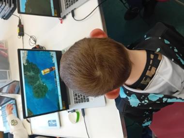 Children Enjoying Coding Sessions and Computer Design Activities