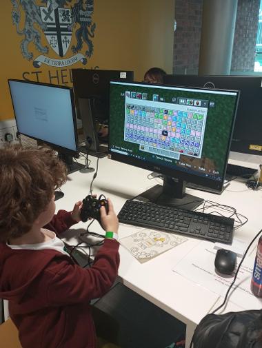 Children Enjoying Coding Sessions and Computer Design Activities