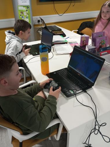 Children Enjoying Coding Sessions and Computer Design Activities