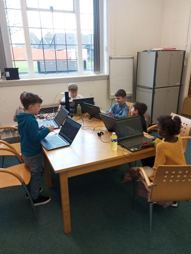 Children Enjoying Coding Sessions and Computer Design Activities