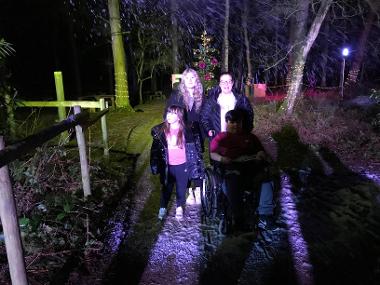 Children and Their Families Enjoying BeWilderwood Present Christmas