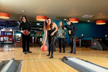 Group playing bowling