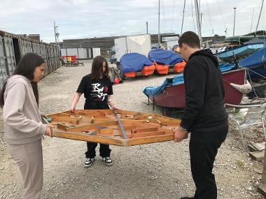 Children and young people participating in problem solving games and an archery session