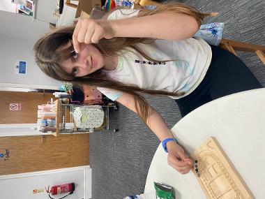 Children and young people enjoying Pottery Painting sessions