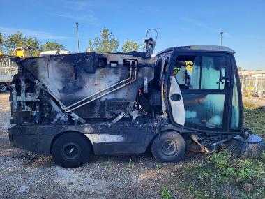 Burnt out road sweeper